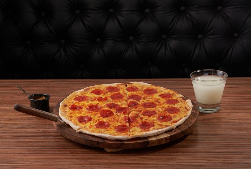 Four cheese vegetarian pizza with mozzarella, gorgonzola, brie and parmesan